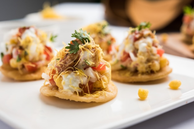 Papri OR Papdi chat  Also known as Sev Batata Puri - popular indian snacks or street food, selective focus