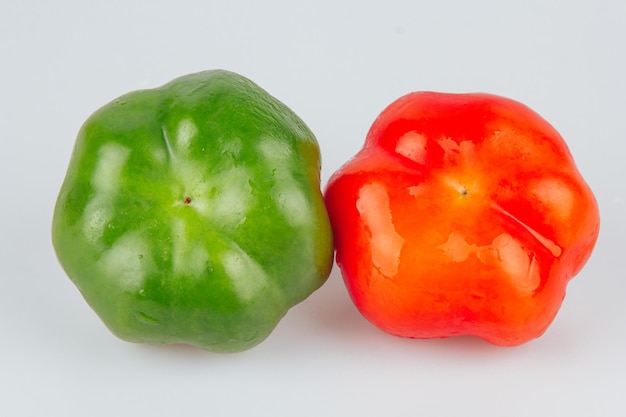 Paprika Pepper isolated on white and gray background Red and green pepper With trajectory clipping Closeup macro photo