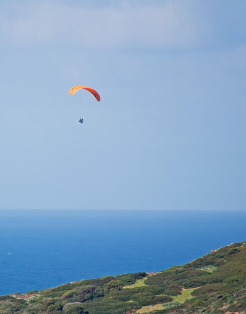 Para glider flying on a clear day