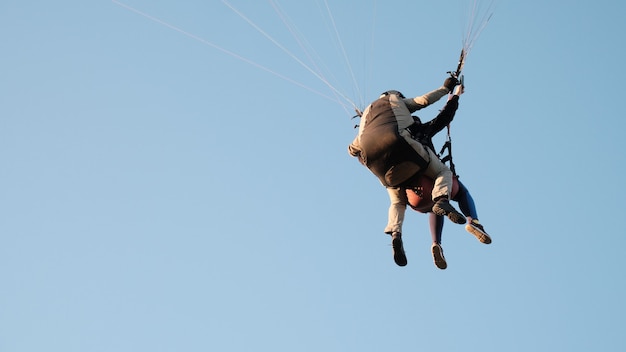 Paragliders against the blue sky. Air sports. Active rest outside the city.