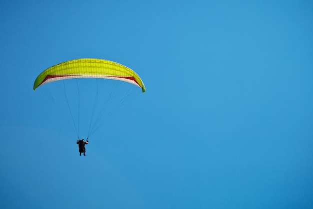 Paragliding along beautiful coastline.