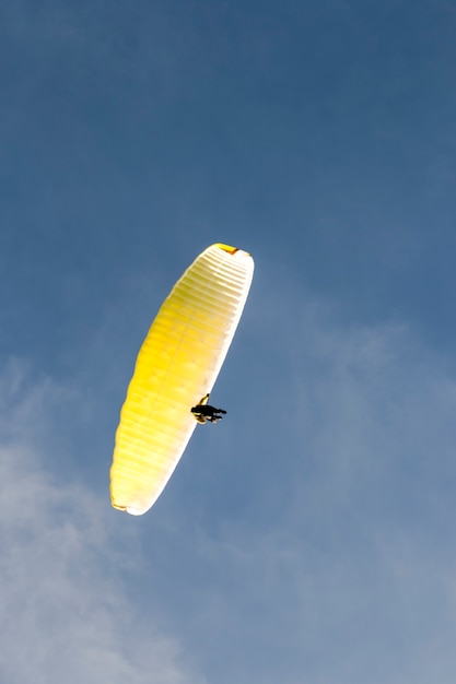 Paragliding in the blue sky