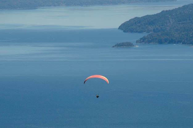 Paragliding flight over lake nahuel huapi