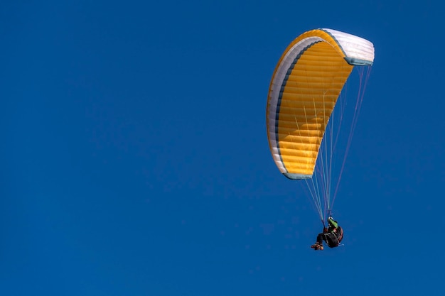 Paragliding hang glider in the blue sky