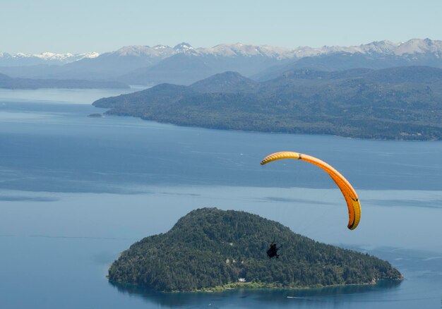 Paragliding over lake nahuel huapi in bariloche argentina