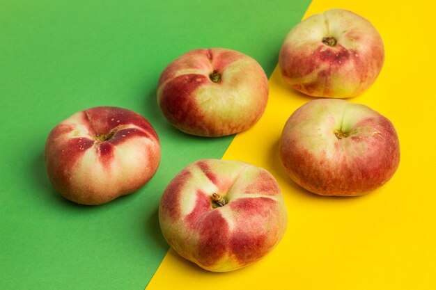 Paraguayan peaches on a green and yellow background