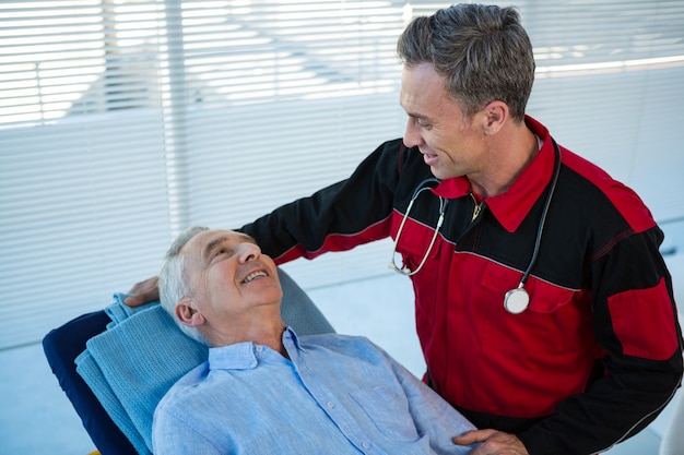 Paramedic interacting with patient