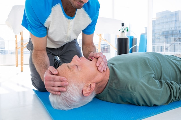 Photo paramedic performing resuscitation on patient