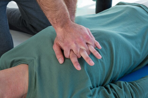 Paramedic performing resuscitation on patient