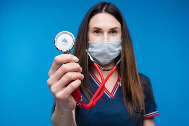 Paramedic in uniform with stethoscope in hand