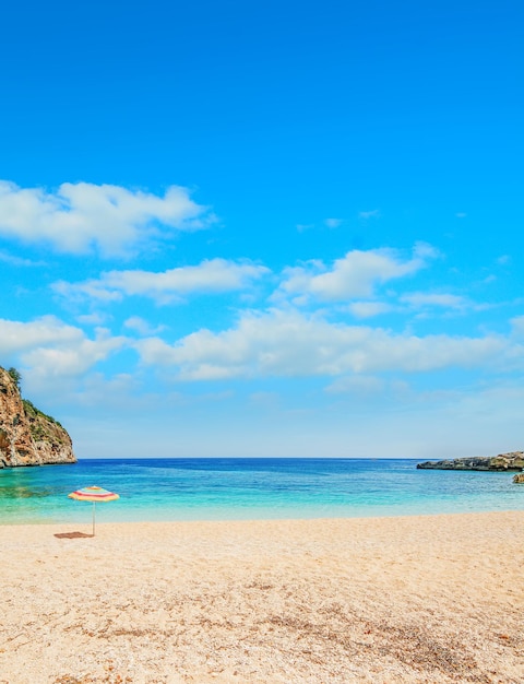 Parasol in Cala Biriola on a clear day Sardinia