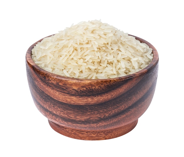 Parboiled rice in a wooden bowl isolated on a white