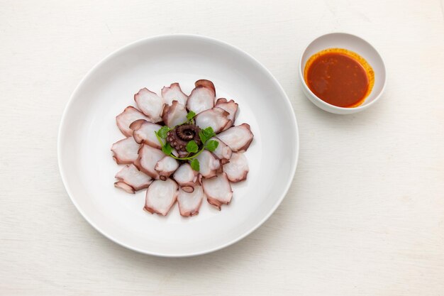 Parboiled and sliced octopus