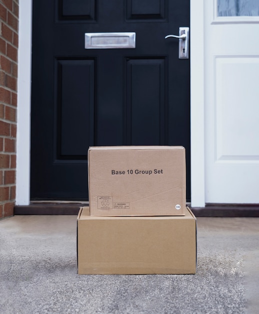 Photo parcel cardboard boxes at front door