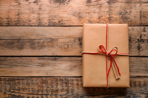 Parcel gift box on wooden background