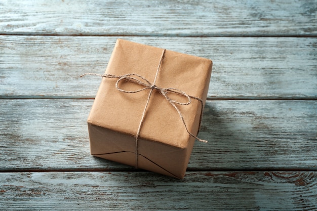 Parcel gift box on wooden background