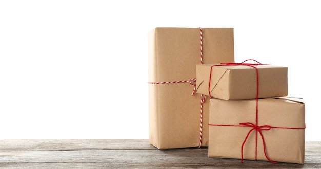 Parcel gift boxes on table against white background