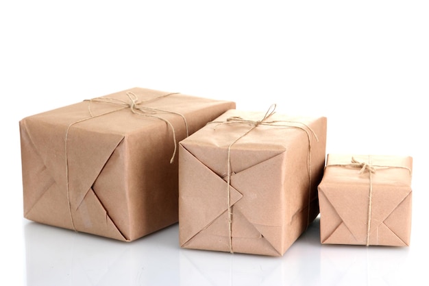 Parcels boxes with kraft paper isolated on white