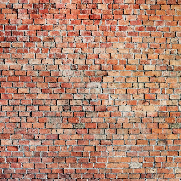 Photo parede de tijolos com uma parede de tijolos e um fundo de parede de tijolos wall of bricks