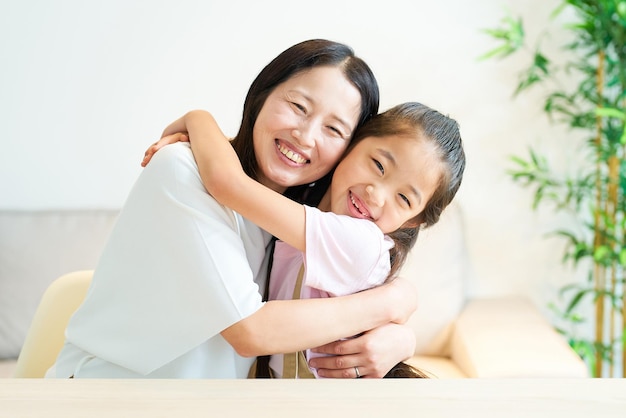 Parent and child hugging with a smile