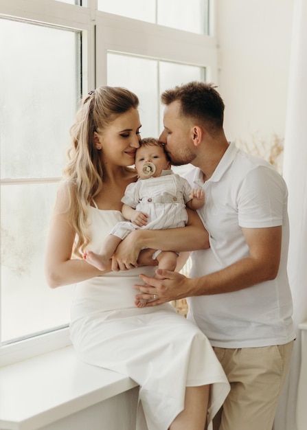 Parent holding baby happy family portrait happy family concept