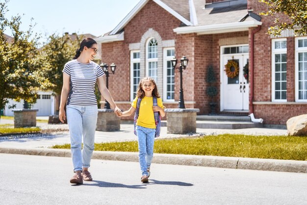 Parent and pupil go to school