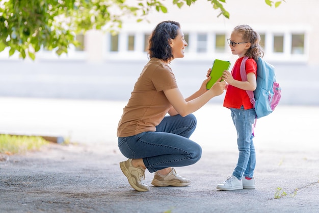 Parent and pupil go to school