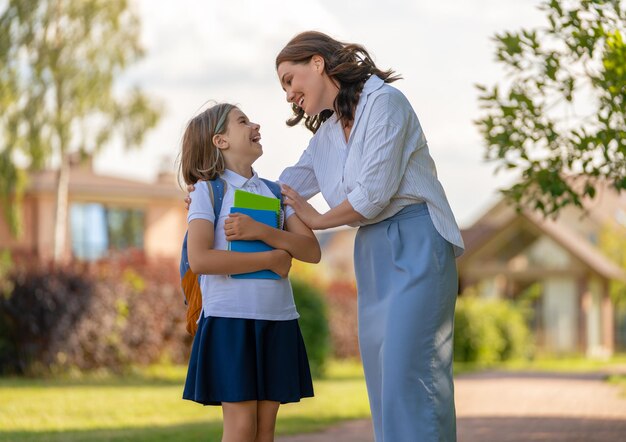 Parent and pupil going to school