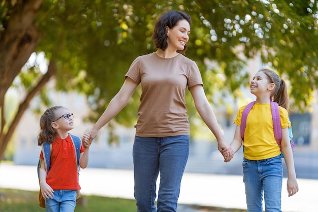 Parent and pupils go to school