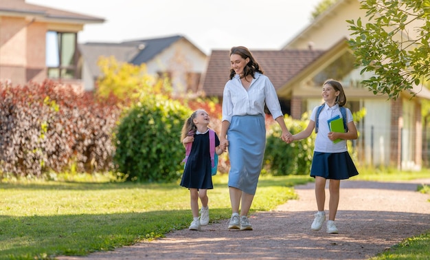 Parent and pupils going to school