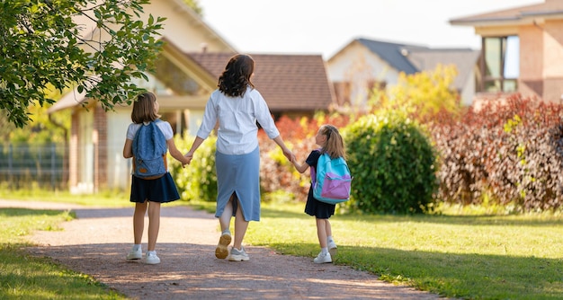 Parent and pupils going to school