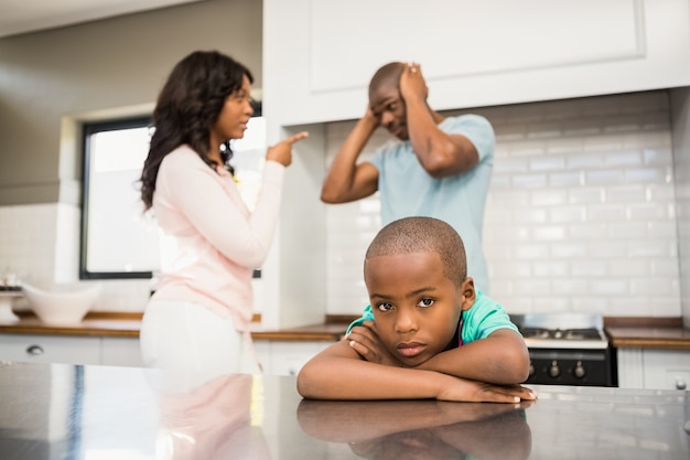 Parents arguing in front of son