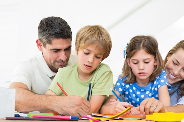 Parents assisting children in coloring 