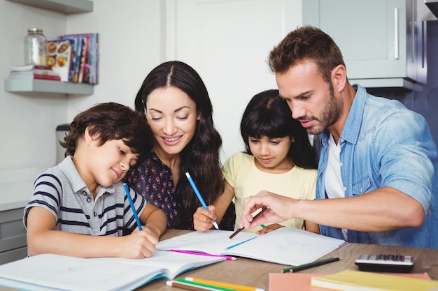 Parents assisting children doing homework 