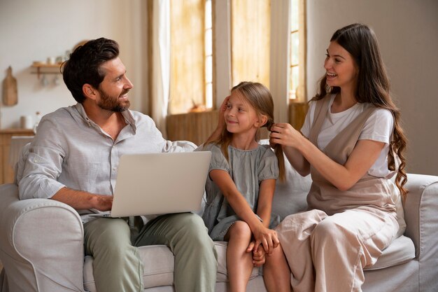 Parents and daughter spending time together while wearing linen clothing