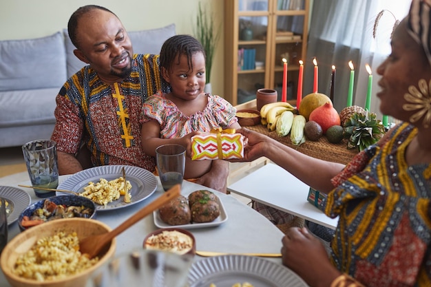 Parents giving present to their daughter