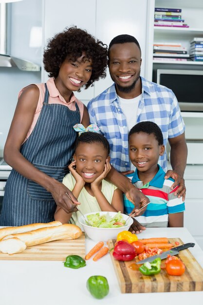 Parents and Kids standing in kitchen at home