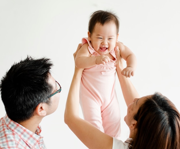 Parents playing with their baby