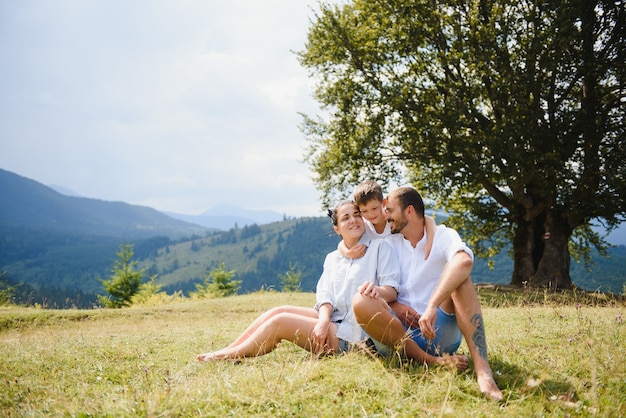 Parents and son relaxing in nature