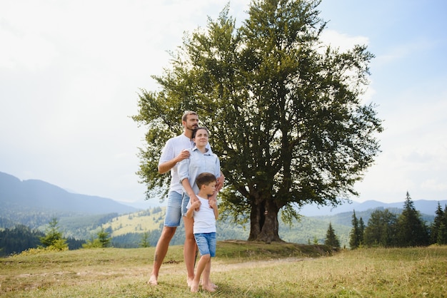 Parents and son relaxing in nature