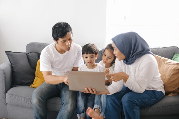 Parents Teaching Kids Using Laptop Fun Learning at Home