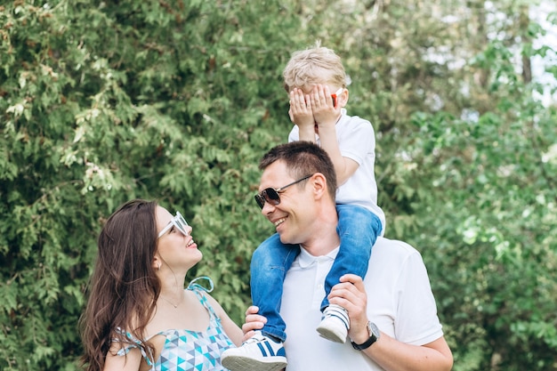 Parents and their little son in the park