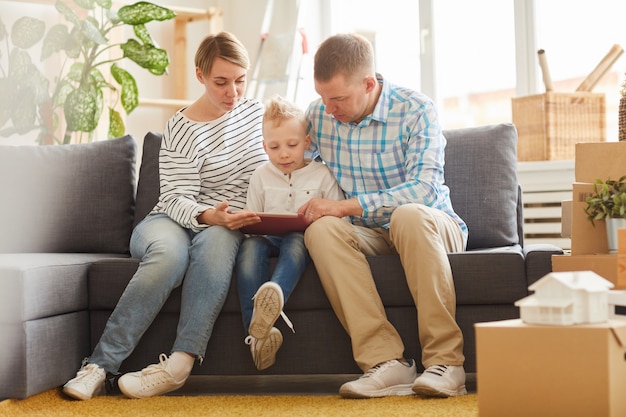 Parents using tablet for digital learning with son