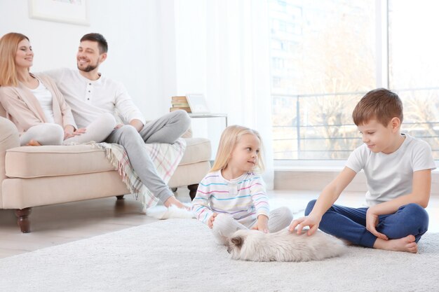 Parents with children and cats at home