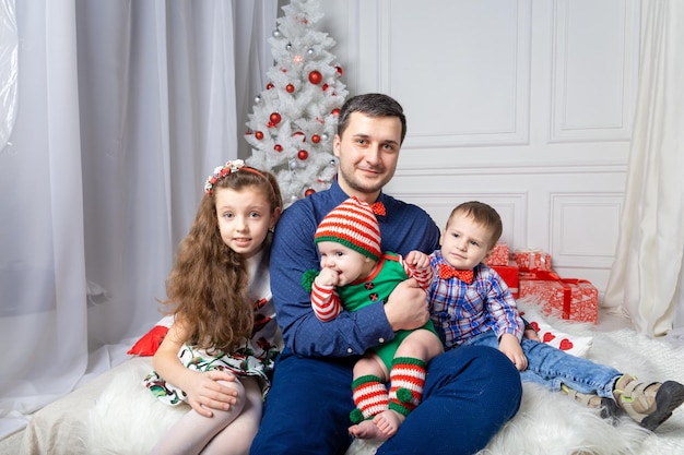 Parents with kids in a Christmas photo session