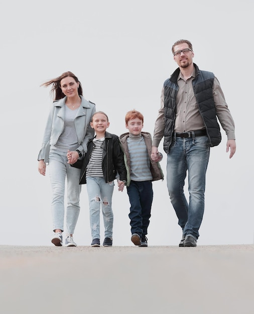 Parents with their children walking along together