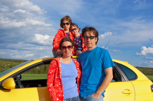 Parents with two kids having car trip