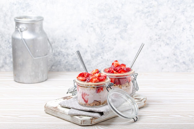 Parfait with strawberries yoghurt and granola in transparent