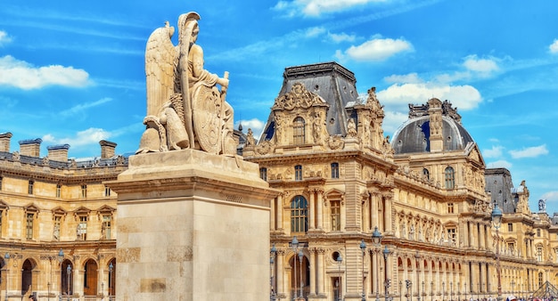 PARIS FRANCE JULY 08 2016 Louvre museum in Paris with tourists on street The Louvre is the biggest museum in word with nearly 35000 historical artefact's