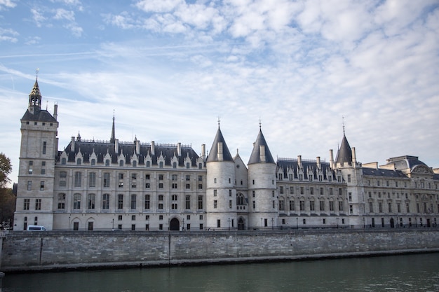 PARIS, FRANCE - OCTOBER 16, 2018: Paris Castle Conciergerie - former royal palace and prison. Conciergerie located on west of Cite Island and today - part of larger complex known as Palais de Justice.